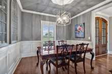 Formal dining room with wainscotting ** this chandelier does not remain **