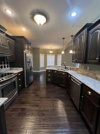 Spacious User Friendly Kitchen with Built-ins along with Custom Cabinets and Counter Tops