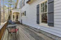 The side porch extends the full depth of the house