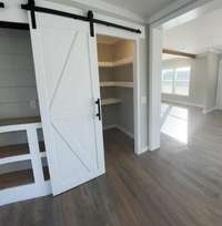Sliding Door to Pantry with lighted shelf area