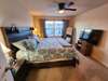 Primary bedroom with ceiling fans & big windows !