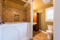 Additional full bath in bedroom 3 on the upper level w/walk-in tub/shower combo!