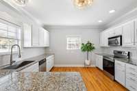 New subway tile backsplash and sleek granite counters