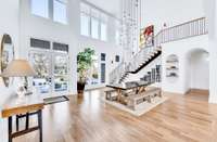 Two story entryway and formal dining makes for an incredible entertaining space. So much natural light!