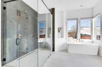 Soaking tub with a rolling hilltop view and zero entry, dual head shower!