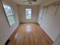 Mud room or office on the back of the home leading out to the backyard.