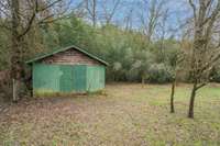 " planting shed " with cement pad to rear of lot.