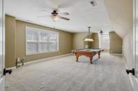 Plenty of space in this bonus room that sits over the three-car garage!