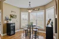 Kitchen nook with bay-style windows.