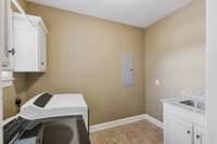 Oversized laundry room with washtub. Washer and Dryer remain!