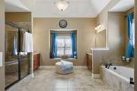 Separate vanities, tile shower, oversized jacuzzi tub, and two walk-in closets - just calling you to relax!