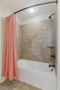 All secondary baths have tile surrounds.