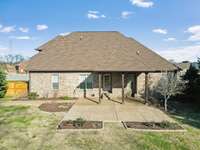 Covered patio and extended patio on .5 acres!