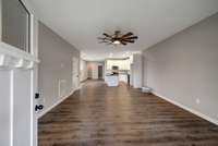 LAMINATE FLOORS LIVING SPACE IS OPEN TO KITCHEN AND EATING AREAS