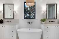 Again, natural light abounds! Dual vanity primary bath on the main level.