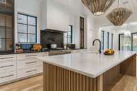 Black & white kitchen with glass-front cabinets