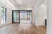 Separate dining room leads to the screened porch with fireplace.  Beverage bar is to the right