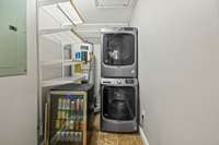Laundry room includes washer dryer & storage. Also includes and this handy drink refrigerator. Great for parties!