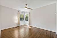 Light and bright Bedroom #3 overlooks the tree lined back yard