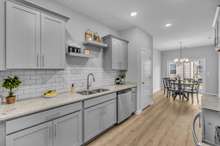 The Chapman Plan has a great Galley-Style kitchen, designed for convenience & function. (This home is similar to the home under construction. Selections may vary, please see listing media for details).