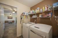 Lots of storage options for this roomy laundry area.