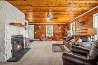 The front door ahead will bring you into this large 25X16 Living Room with Wood Burning Fireplace.