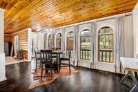 This Dining area gives you access and views to the back of the property, as well.