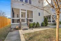 back entrance to the home is through the screened porch