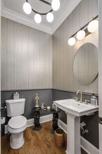 Powder room on the main floor has stunning wallpaper