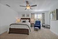 Bedroom 3 upstairs offers carpeted flooring, a double window and a newly installed ceiling fan. Check out the size of this bedroom!