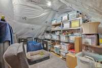 The storage space available in this home is nothing short of amazing. Notice the insulation added to this space! Shelving in this room will not convey.