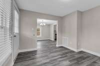 The flooring carries from the living area to the dining room for an attractive look.