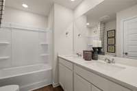 Photos of our Aspen model home shown - dual sinks in secondary upstairs bathroom