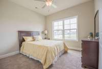 Guest bedroom with double wide closets.