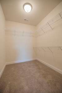 Walk-in closet off the owner's bath suite.