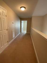 This hall leads to the private Bedroom 3.  The door to the left is full sized.  Walk in to your storage!