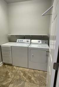 Laundry room - washer, dryer, shelves and drawers remain!