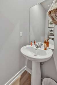 This convenient half bath features a stylish pedestal sink! 701 Mickelson Way  Lebanon, TN 37087