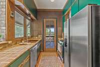 The galley layout provides another connection to the 350+ sq ft screened porch with gas line for grilling…