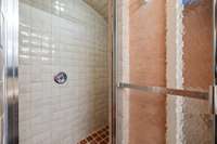 Arched steam shower with more custom tiles…