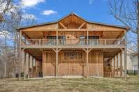 New barndominium with 3 beds, 2.5 baths, 4 animal stalls, and 4 car garage.