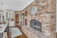 How cozy- a kitchen fireplace!