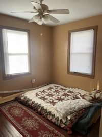 Bedroom #1 on main level with hardwood floors