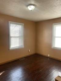 Bedroom #2 on main level with hardwood floors