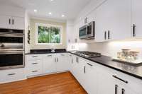 Light and bright kitchen with double oven and gas cooktop