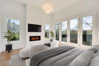 Master bedroom w/ natural light, fireplace, deck.