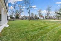 Current view from the back porch. Several of the neighbors do not have a fence, so you have a beautiful, grassy view from the home.