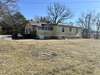 Home has nice sized fenced yard that opens up to partially cleared acreage