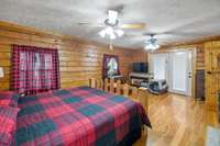 Escape to comfort in the primary bedroom boasting double ceiling fans and beautiful hardwood floors! 1028 Cook Rd  Liberty, TN 37095