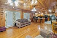 Welcome to the heart of relaxation in this charming living room with hardwood floors and easy access to the expansive wraparound porch, inviting the outdoors in. 1028 Cook Rd  Liberty, TN 37095